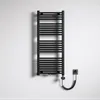 A black electric towel radiator mounted on a textured white wall, with a coiled power cord connecting to a wall socket. Produktbild-Vorschau