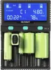 A close-up front view of a battery charger with multiple batteries inserted. Produktbild-Vorschau