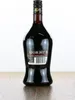 A bottle of Kirsberry Kirschlikör on a wooden surface against a white background. Produktbild-Vorschau