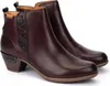 A pair of brown leather ankle boots with black accents and stitching, presented on a white background. Voir les images du produit
