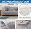 Grauer gesteppter Sofabezug auf einem Holzsofa, mit Nahaufnahmen der Stofftextur und rutschfester Rückseite Náhľad obrázku produktu