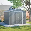 A grey metal garden shed with double doors, situated on a concrete base in a grassy yard, with a house and trees in the background. Produktbild-Vorschau
