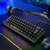 A gaming keyboard, headphones, and mouse are arranged on a desk with colorful RGB lighting. Produktbild-Vorschau