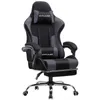 A gaming chair with a footrest, headrest, and lumbar pillow. Anteprima dell’immagine prodotto