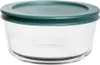 A clear glass food storage container with a green lid. Produktbild-Vorschau