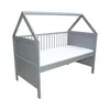 A grey baby bed with a house-shaped frame and a white mattress, shown against a white background. Produktbild-Vorschau
