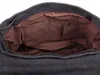 The inside of a dark gray canvas bag with brown fabric lining and multiple internal pockets. Podgląd zdjęcia produktu