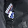 A close-up view of a black backpack pocket with a customer card and tissues inside. Náhľad obrázku produktu