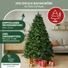 A decorated Christmas tree in a living room setting with gifts underneath. Produktbild-Vorschau