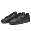 A pair of black Puma sneakers on a white background. Produktbild-Vorschau