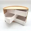A white and natural wood tiered organizer on a white background. Náhled obrázku produktu