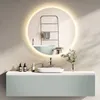 A modern bathroom vanity with a round LED mirror above it. Voir les images du produit