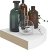 Four glass vases and a plant on a white shelf. Produktbild-Vorschau