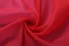 A close-up, swirling view of red fabric. Produktbild-Vorschau