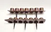A product shot of brown plastic garden edging pieces arranged in two rows against a white background. Produktbild-Vorschau
