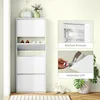 A white shoe cabinet with multiple compartments, shown in a hallway or entryway setting. Produktbild-Vorschau