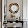 A decorative wall clock is displayed on a wall above a console table in a well-lit room. Podgląd zdjęcia produktu