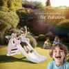 Children playing on a slide in a backyard. Náhled obrázku produktu