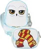 A white owl-shaped crossbody bag and a rectangular pouch with a scarf design are displayed against a white background. Produktbild-Vorschau