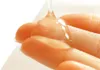 A close-up shot of a clear gel being squeezed onto fingers. Produktbild-Vorschau