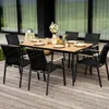 An outdoor dining set on a wooden deck. Produktbild-Vorschau