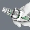A hand wearing a white glove is holding a socket wrench attachment. Podgląd zdjęcia produktu