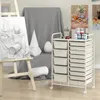 An art studio setup with a drawing easel, still life objects, and a storage cart. Podgląd zdjęcia produktu