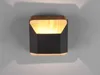 A modern wall light fixture mounted on a light gray wall. Podgląd zdjęcia produktu