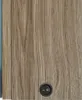 A close-up view of a wooden surface with a black circular switch. Podgląd zdjęcia produktu