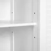 A close-up view of a white shelf in a cabinet, showing the mounting pegs and screw holes. Produktbild-Vorschau