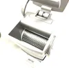A close-up, angled view of a silver electric cheese grater with its lid open, revealing the grating drum. Anteprima dell’immagine prodotto
