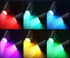 A collage of images showing a black neck fan emitting light in different colors. Produktbild-Vorschau