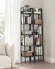 A tall, narrow ladder bookshelf filled with books and decorative items, placed next to a white sofa and in front of a window with sheer curtains. Náhled obrázku produktu