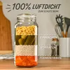 A glass jar filled with different food items, illustrating its airtight seal for various preservation methods. Podgląd zdjęcia produktu