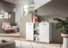 A modern living room with a pink armchair, a white sideboard, and decorative items. Produktbild-Vorschau