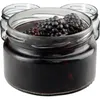 Three glass jars filled with blackberries and juice, with the front jar in focus. Podgląd zdjęcia produktu