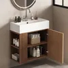 A bathroom vanity with a sink and storage cabinet. Voir les images du produit