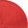 A close-up view of a red, circular placemat with a woven texture, showing concentric rings. Produktbild-Vorschau