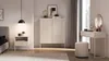 A bedroom scene featuring a highboard, nightstand, bed, and vanity table. Anteprima dell’immagine prodotto