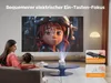 A mother and child are watching a movie projected by a mini projector in a living room. Produktbild-Vorschau