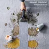 A hand is using a portable carpet cleaner to remove stains from a carpet. There are paw prints, mud, and spilled drinks on the carpet. Produktbild-Vorschau