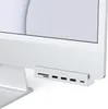 A close-up shot of a Satechi USB-C hub attached to the bottom of an iMac. Produktbild-Vorschau