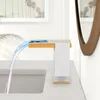 A modern bathroom sink with a waterfall faucet. Podgląd zdjęcia produktu