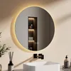A modern bathroom setting with a round LED mirror above a sink and faucet. Produktbild-Vorschau
