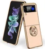 A pink and gold flip phone case with a ring holder is shown. Produktbild-Vorschau