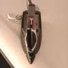 An iron is placed on a white surface. Podgląd zdjęcia produktu