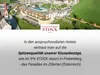 Aerial view of a resort and surrounding landscape, with text overlay. Produktbild-Vorschau