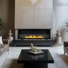 A modern living room with a fireplace and coffee table. Anteprima dell’immagine prodotto