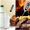 A split image showing a digital thermometer measuring milk on the left and cooked meat on the right, with a fireplace in the background. Produktbild-Vorschau
