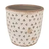 A beige ceramic pot with black heart designs. Produktbild-Vorschau